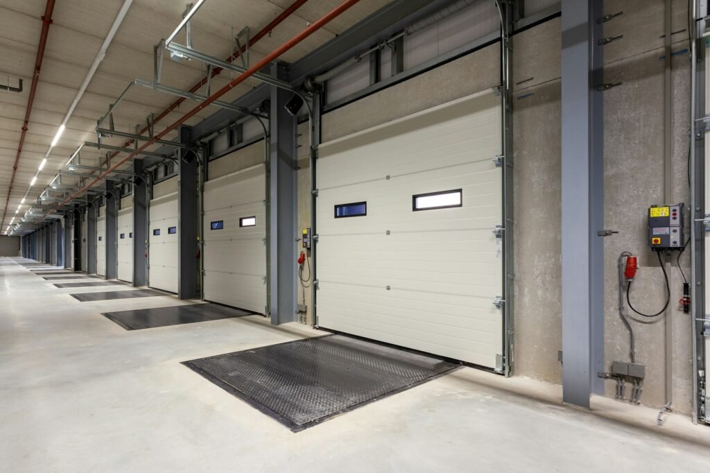 Inside of a warehouse with a row of loading bays