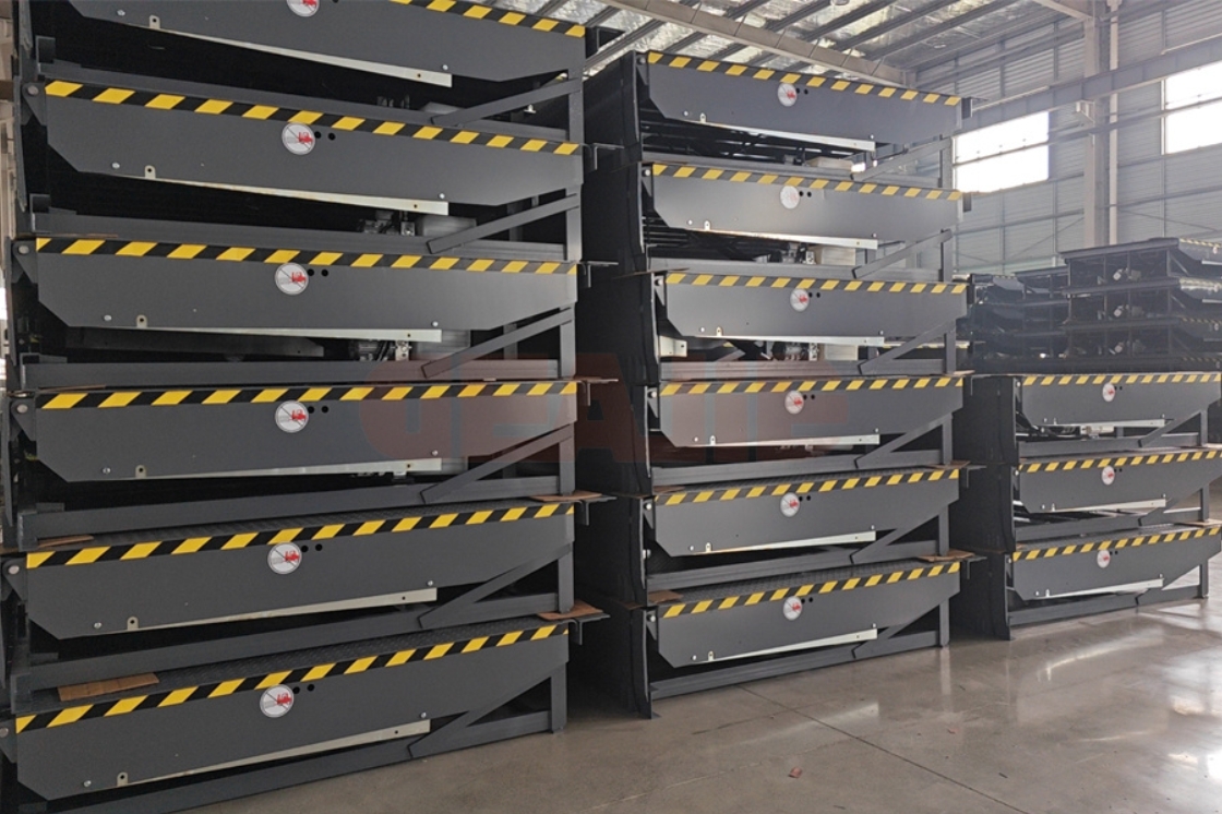 GEAJIE hydraulic dock leveler extended lip in operation, warehouse loading/unloading scene with high-capacity hydraulic system